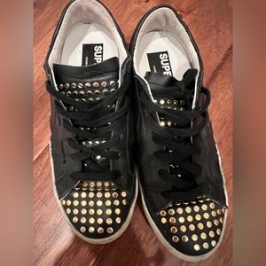 Golden Goose Super-Star LTD sneakers black leather with tongue with gold studs